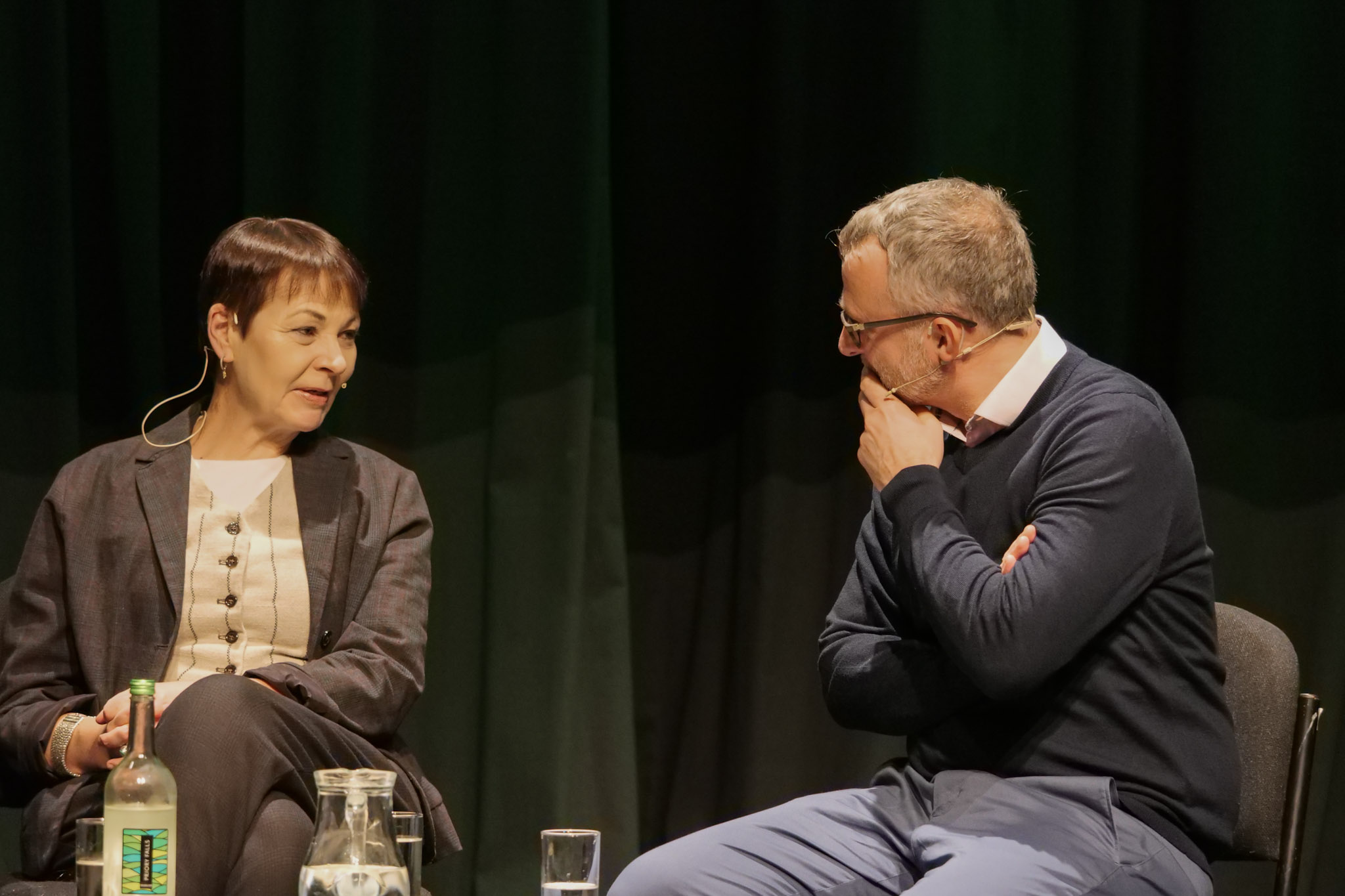 Green PPC Daniel Wilson on stage with Caroline Lucas MP at an event in Cheltenham